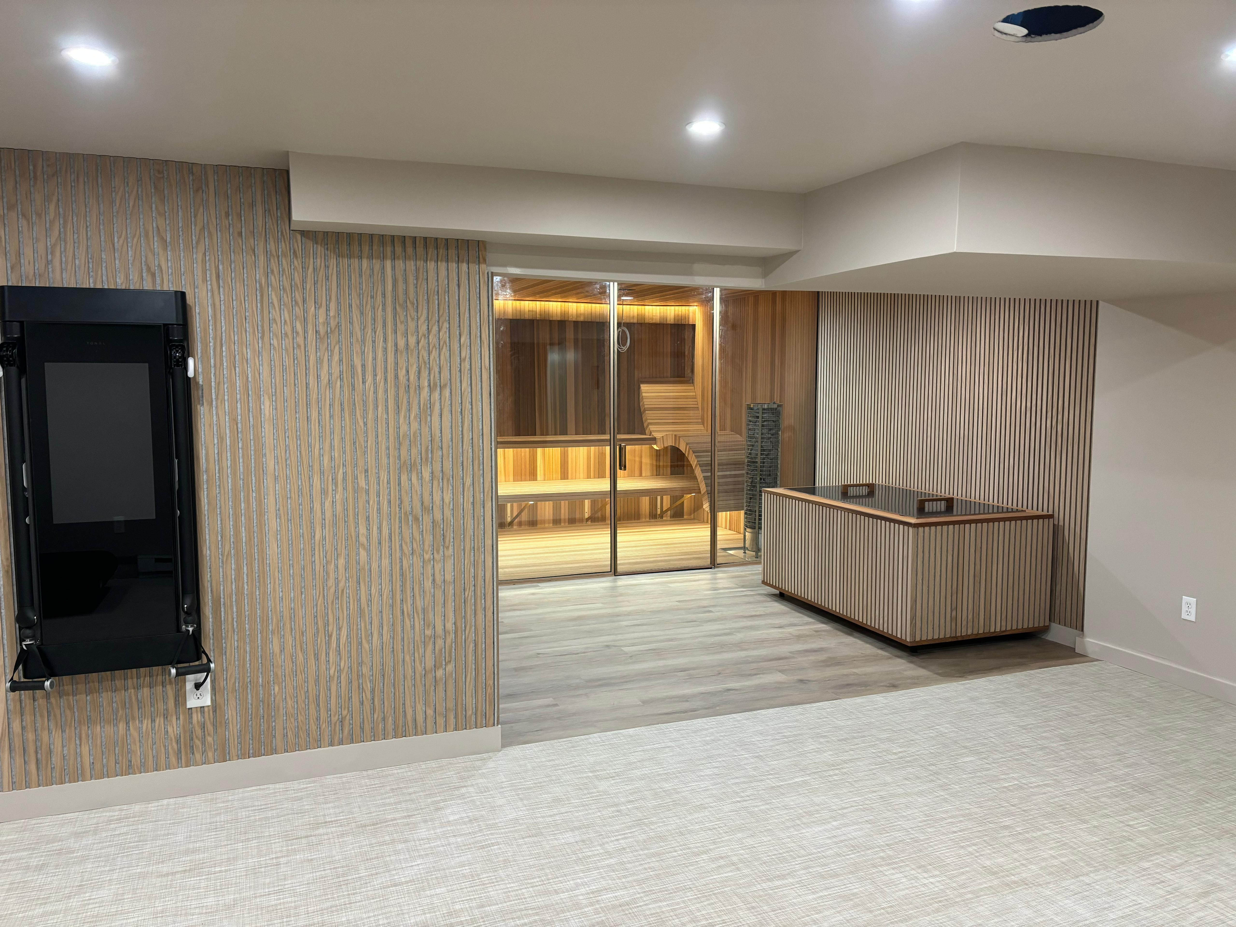 Custom cold plunge with external chiller, white oak fluted panels and barn door