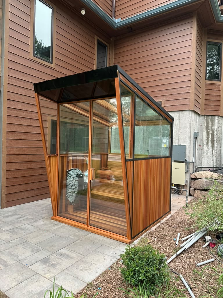 Glass roof cedar sauna against the vacation home exterior, Monticello NY