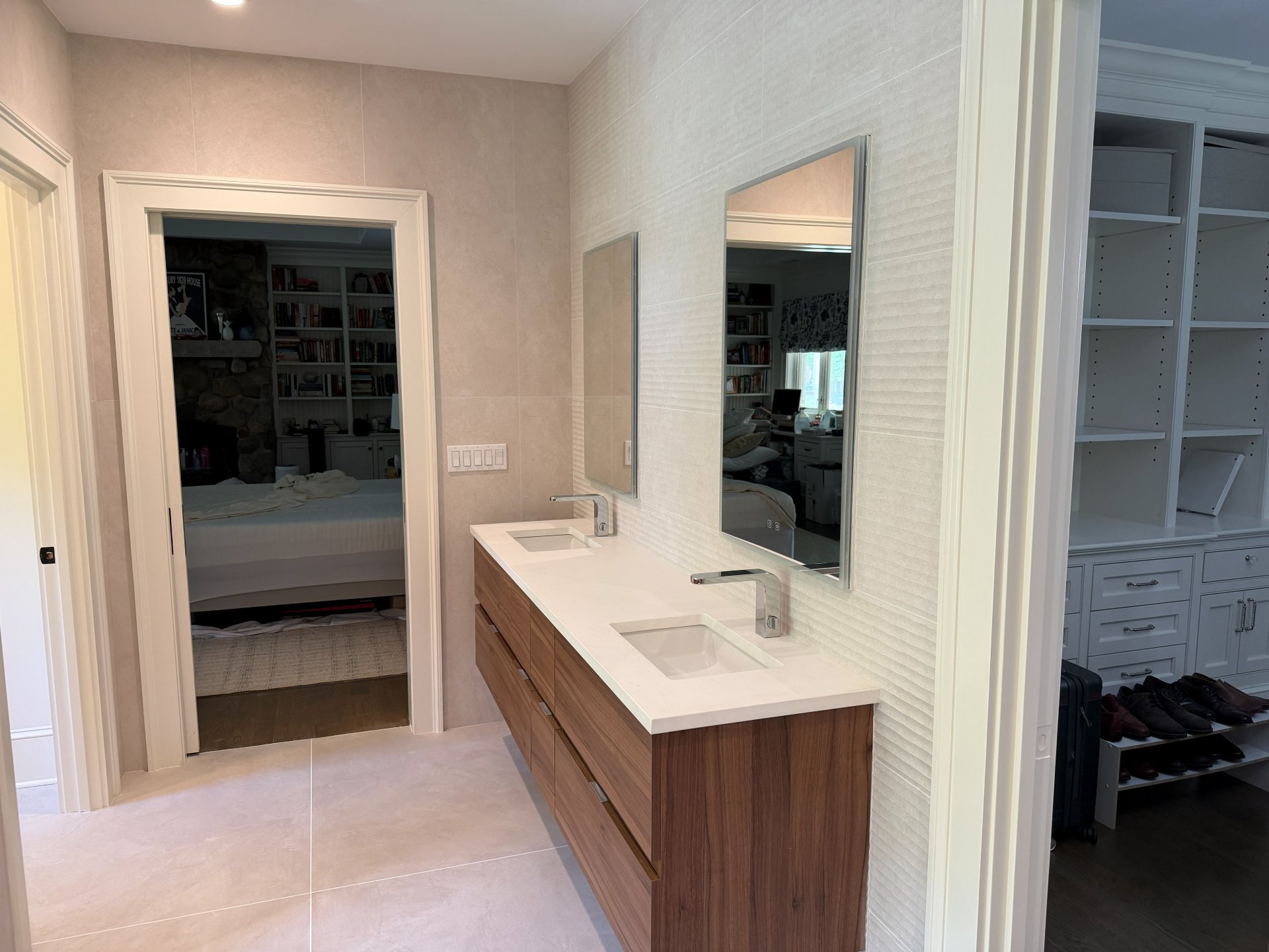 Double vanity with Porcelanosa tile and custom cabinetry — The Wellness Suite