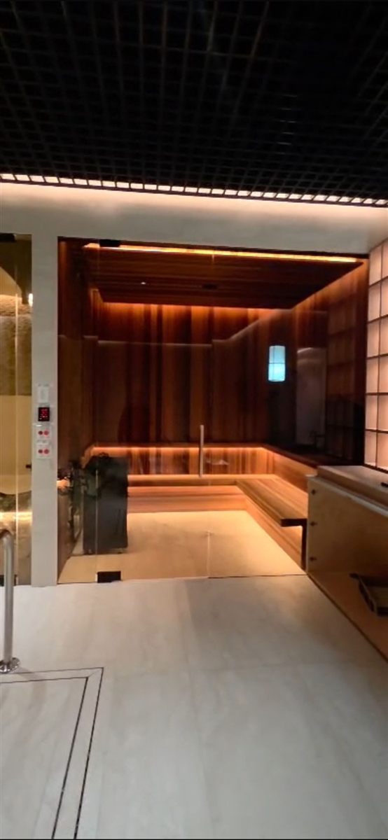 Commercial spa corridor leading to a custom sauna