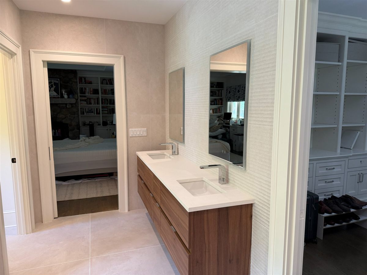 Primary suite vanity opening onto the bedroom, illustrating en-suite proximity for a Cielo sauna build