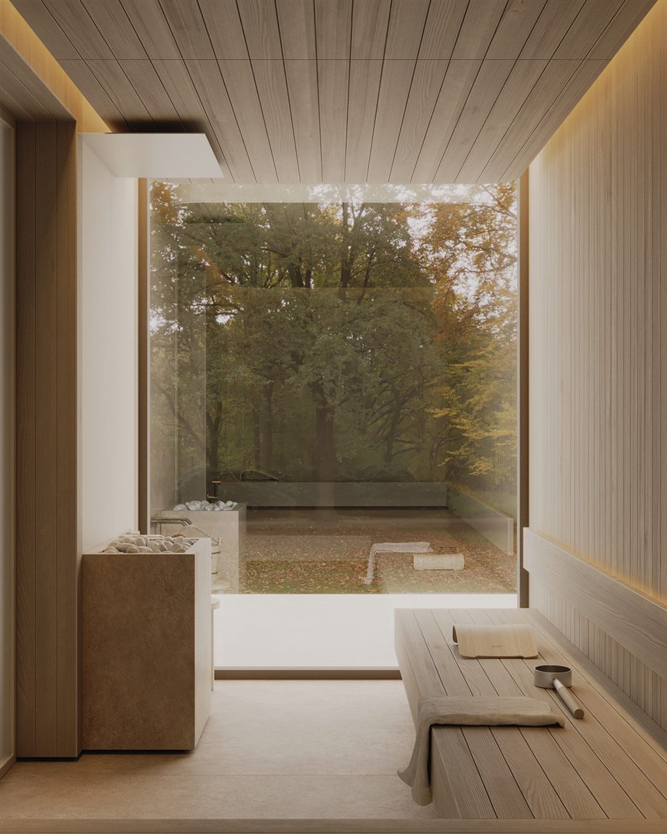Light cedar sauna interior with a glass wall overlooking a wooded garden