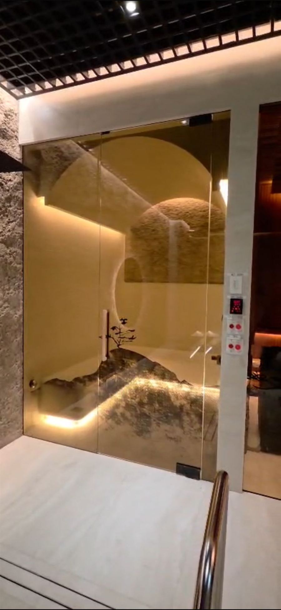 A gold-framed glass door in a commercial wellness suite